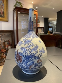 A Chinese blue, white and copper-red bottle vase with a deer and birds among blossoming branches, Daoguang