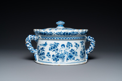 A Dutch Delft blue and white tureen and cover with putti, 17/18th C.