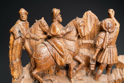 A Flemish carved oak retable fragment: 'Roman soldiers on mount Golgotha', ca. 1500