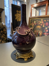 A Chinese monochrome aubergine-glazed bottle vase with gilt bronze mounts, Qianlong mark, 19/20th C.