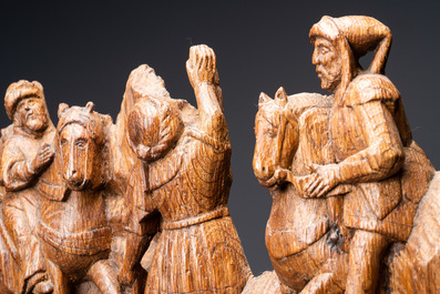 A Flemish carved oak retable fragment: 'Roman soldiers on mount Golgotha', ca. 1500