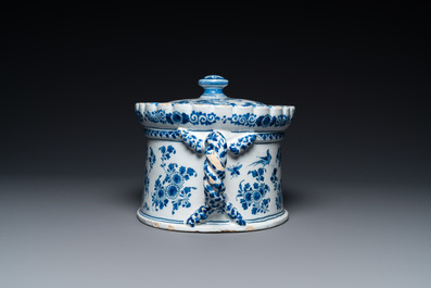 A Dutch Delft blue and white tureen and cover with putti, 17/18th C.