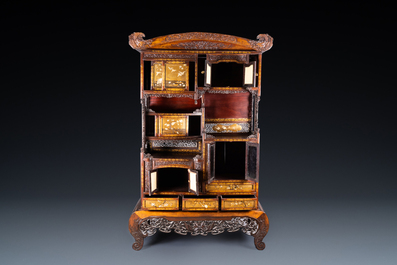 A Japanese 'chigaidansu' gilt-lacquered wood cabinet with finely carved ivory insets, Meiji, 19th C.