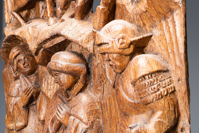 Un fragment de retable en ch&ecirc;ne sculpt&eacute;: 'Soldats romains sur le mont Golgotha', Flandres, vers 1500