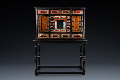 A tortoise veneer, gilt copper, ebony and ebonised wooden mirrored interior cabinet on stand, Antwerp, 17th C.