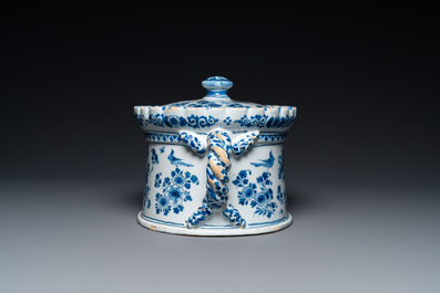 A Dutch Delft blue and white tureen and cover with putti, 17/18th C.