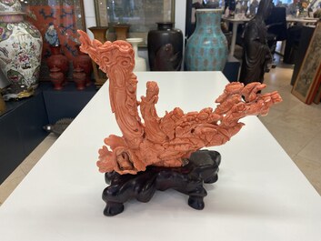 A large Chinese carved red coral group with two ladies surrounded by birds, fish and flowers, 19th C.