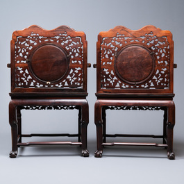 A pair of Chinese mother-of-pearl-inlaid wooden chairs with blue and white porcelain plaques, 19th C.