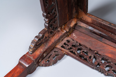 A Chinese rectangular carved wooden table with marble top, 19th C.