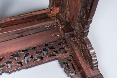 A Chinese rectangular carved wooden table with marble top, 19th C.