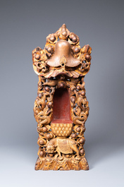 A large Chinese gilded and lacquered wooden reticulated Buddhist shrine, 17/18th C.