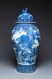 A massive Japanese blue and white Seto vase and cover with shishi and an eagle, Meiji, 19th C.