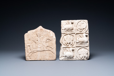 A marble 'horserider' tile fragment and a sandstone fragment with birds and floral vines, Persia, 13th C. and/or later