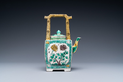 A Chinese verte biscuit teapot and cover, Kangxi