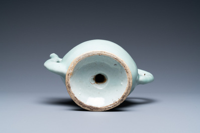 A Chinese relief-decorated peach-shaped 'cadogan' teapot in copper-red and blue on celadon-ground, 19th C.