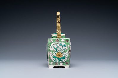 A Chinese verte biscuit teapot and cover, Kangxi