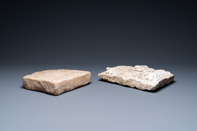 A marble 'horserider' tile fragment and a sandstone fragment with birds and floral vines, Persia, 13th C. and/or later