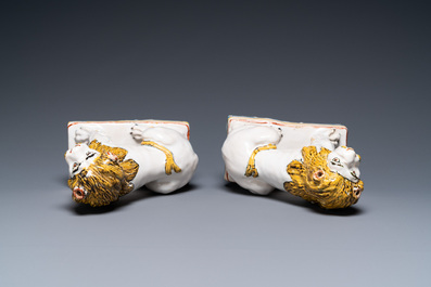 A pair of polychrome French faience lions, Rouen, 1st half 18th C.