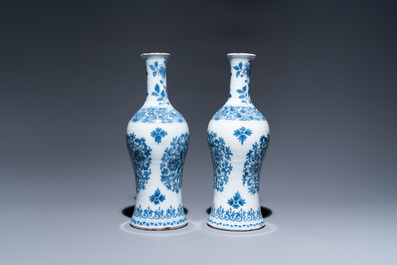 A pair of Dutch Delft blue and white bottle vases with floral design, late 17th C.