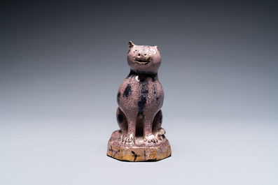 A manganese faience model of a cat, North of France, 18/19th C.