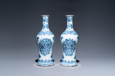A pair of Dutch Delft blue and white bottle vases with floral design, late 17th C.