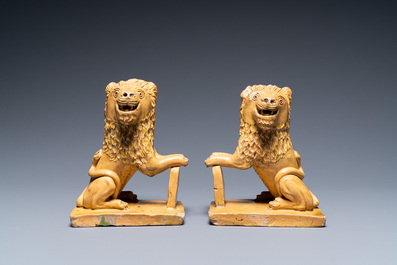 Une paire de lions en poterie flamande ou du nord de la France, sign&eacute;e et dat&eacute;e 1865