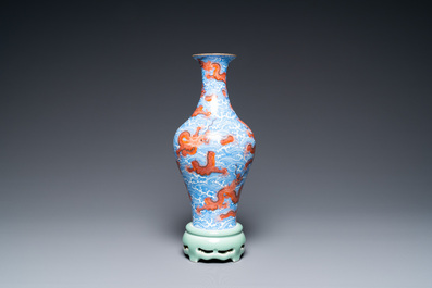 A Chinese revolving 'dragon' vase on celadon stand, Qianlong mark, 20th C.