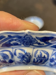 Three Chinese blue and white lotus-shaped 'acupuncture' cups and saucers, Kangxi