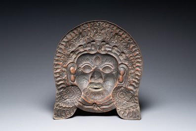 A large Tibetan gilt copper repouss&eacute; mask of Bhairava, Tibet or Nepal, 19th C.