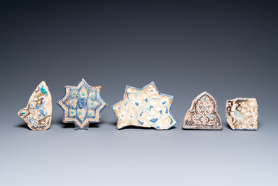 A Kashan star tile and four fragments of luster-glazed tiles, Iran, 13/16th C.