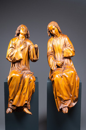 Two impressive Flemish carved oak figures of seated angels, 17th C.