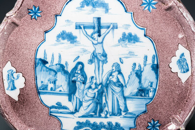 An exceptionally large Dutch Delft blue, white and manganese 'Golgotha' plaque, 18th C.