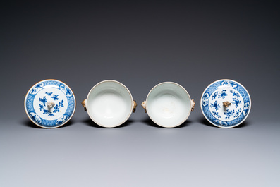 A pair of Chinese blue and white covered bowls, 19th C.