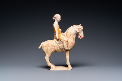 A Chinese painted pottery 'lady on horseback' group, Tang