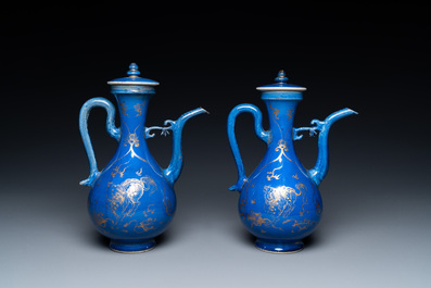 A pair of Chinese gilt-decorated powder blue-ground 'qilin' ewers and covers, Kangxi