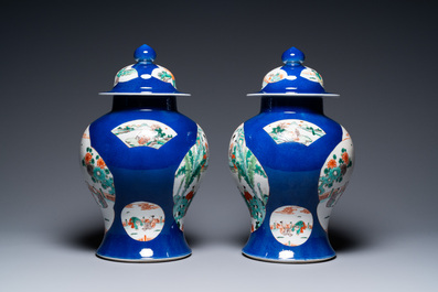 A pair of Chinese famille verte powder blue-ground vases and a fish bowl, 19th C.