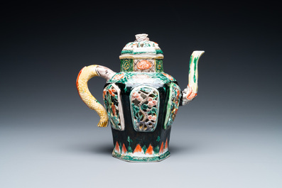 A Chinese verte biscuit reticulated teapot and cover, Kangxi