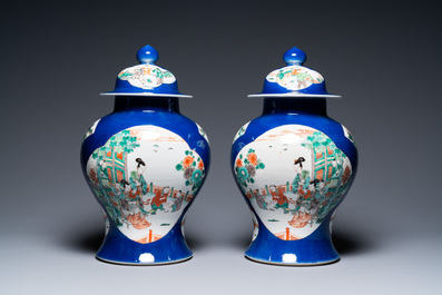 A pair of Chinese famille verte powder blue-ground vases and a fish bowl, 19th C.