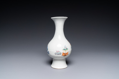 A Chinese famille rose vase with figures and antiquities, Yongzheng