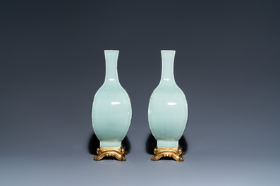 A pair of Chinese monochrome celadon vases with gilt bronze mounts, 18/19th C.