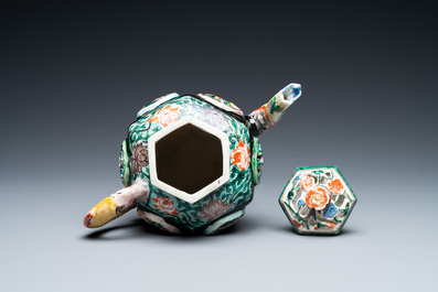 A Chinese verte biscuit reticulated teapot and cover, Kangxi