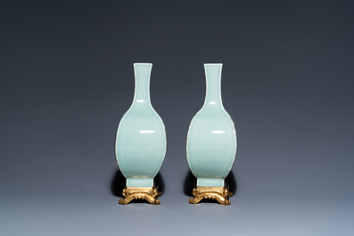 A pair of Chinese monochrome celadon vases with gilt bronze mounts, 18/19th C.