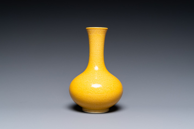 A Chinese monochrome yellow-glazed bottle vase with incised dragon design, Daoguang mark, 19/20th C.