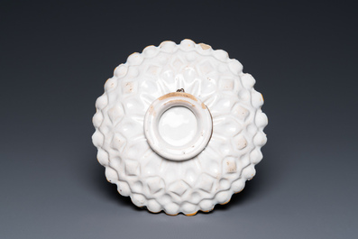 A ribbed polychrome 'grotesque' saucer with a putto holding an orb, Willem Jansz. Verstraeten, Haarlem, 1645-1655