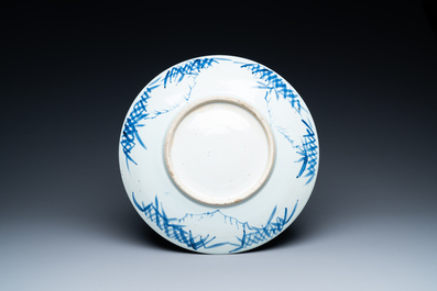 Three Chinese blue and white dishes with dragons, phoenixes and Buddhist lions, 19th C.