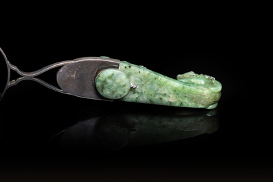 A Chinese jade belt buckle mounted as a table lighter in silver by Gump &amp; Co, Qing and 20th C.