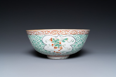 A Chinese famille verte relief-decorated bowl with squirrels and rabbits, Kangxi