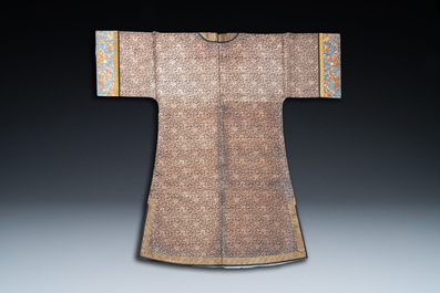 A Chinese embroidered silk woman's robe with floral scrolls, 19th C.