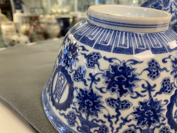 A pair of Chinese blue and white 'wan shou wu jiang' bowls, Qianlong mark and of the period