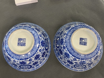 A pair of Chinese blue and white 'wan shou wu jiang' bowls, Qianlong mark and of the period